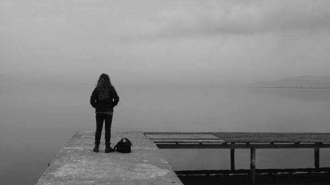 woman standing on dock