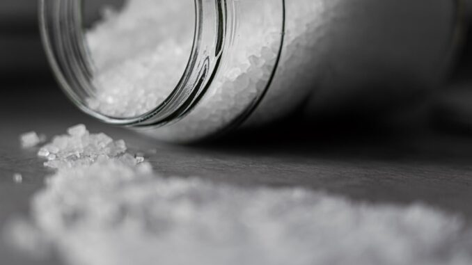 selective focus photo of salt in glass jar