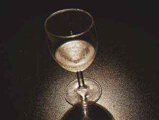 clear wine glass on black surface