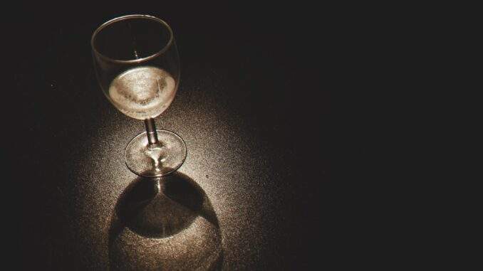 pexels-photo-112988 clear wine glass on black surface