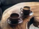 two brown ceramic mugs